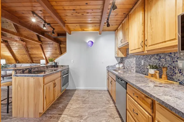 a kitchen with a stove and a table