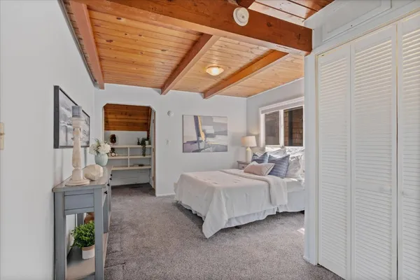 a view of bedroom with furniture and staircase