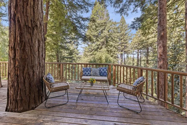 a view of balcony with wooden floor and outdoor space
