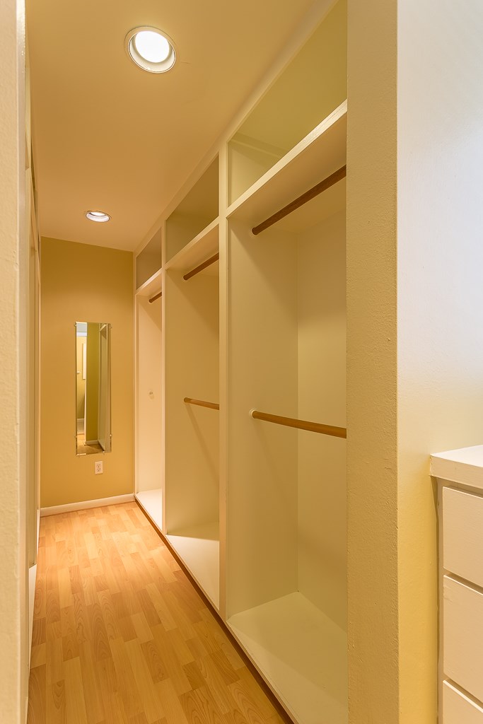 2349 Albans Road, Unit 2 Houston, TX 77005 - Photo 21 of 25 Discover the primary bedroom's walk-in closet, offering ample storage and sleek design for a perfect blend of luxury and functionality.