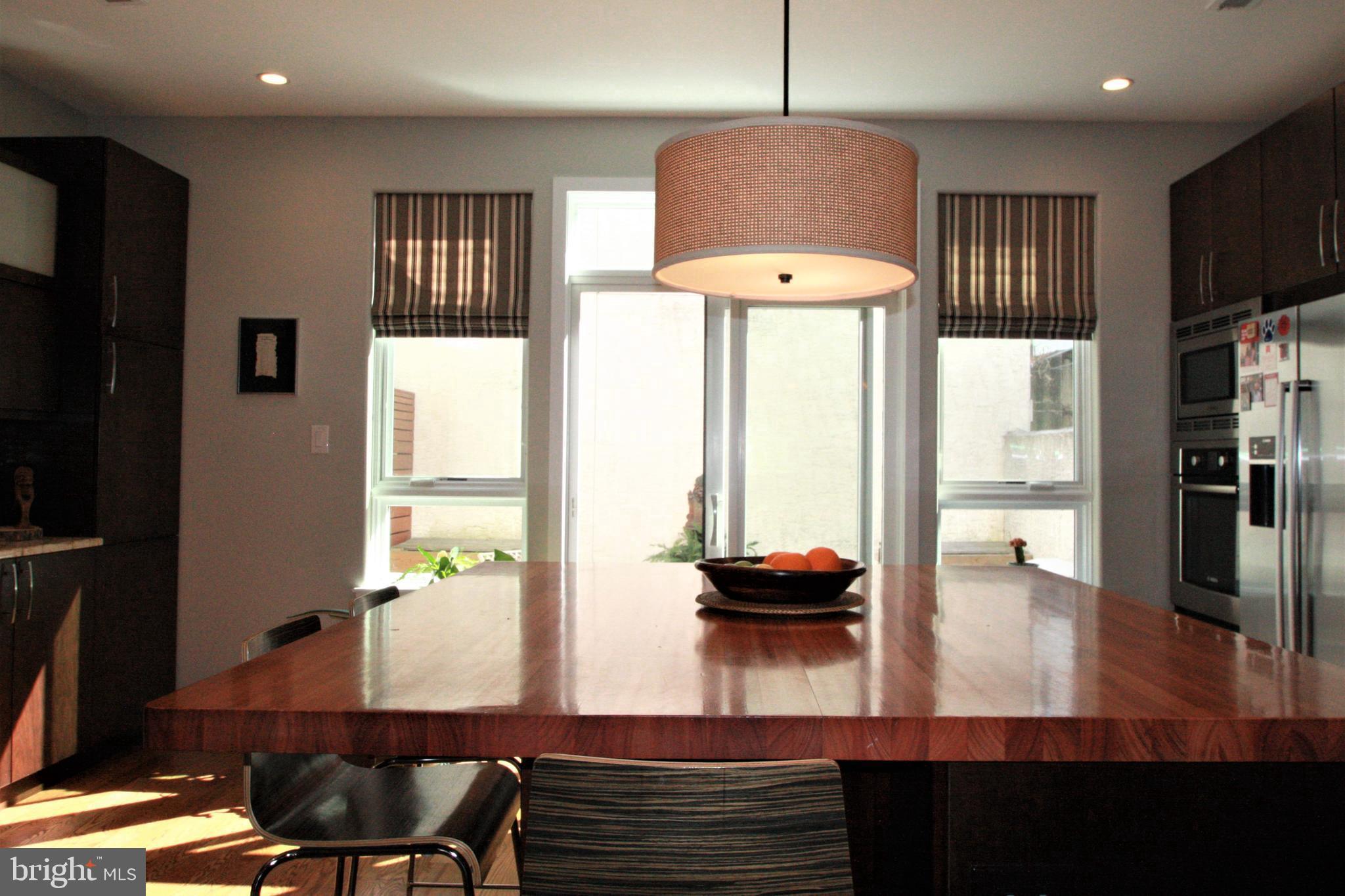 1238 Reed Street Philadelphia, PA 19147 - Photo 5 of 37 Kitchen 2 featuring island and sliders to patio