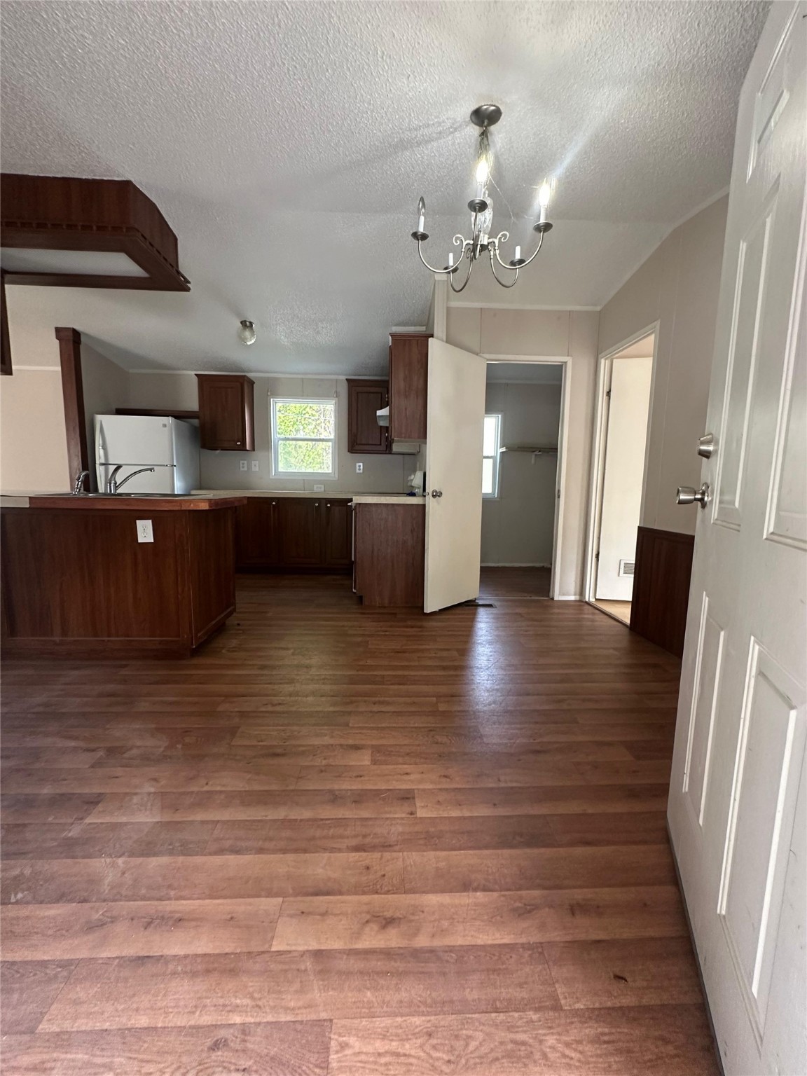 13521 Ann Louise Road Houston, TX 77086 - Photo 2 of 13 a view of a hallway with wooden floor and staircase