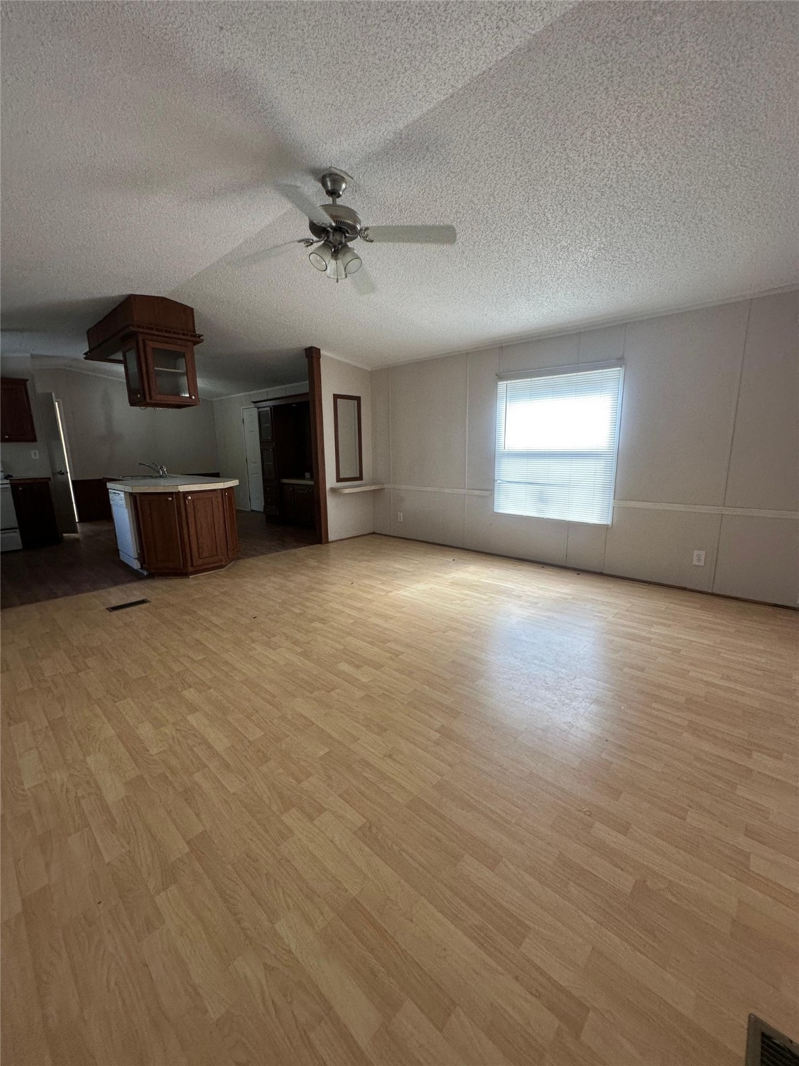 13521 Ann Louise Road Houston, TX 77086 - Photo 5 of 13 an empty room with windows and fireplace