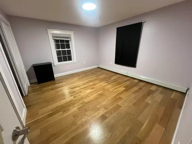 a view of an empty room with windows