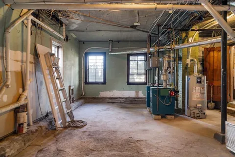 a yard with green space and trees