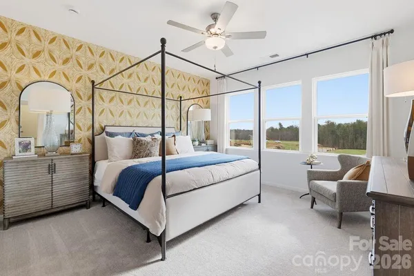 a bedroom with a bed and with outer view