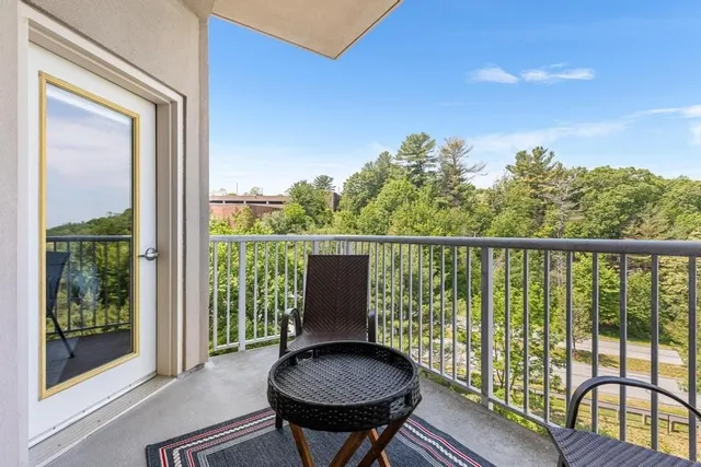 a view of a balcony with furniture