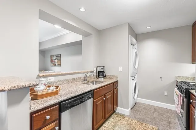 a spacious bathroom with a granite countertop sink and a mirror
