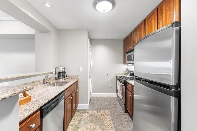 a kitchen that has a sink and a stove