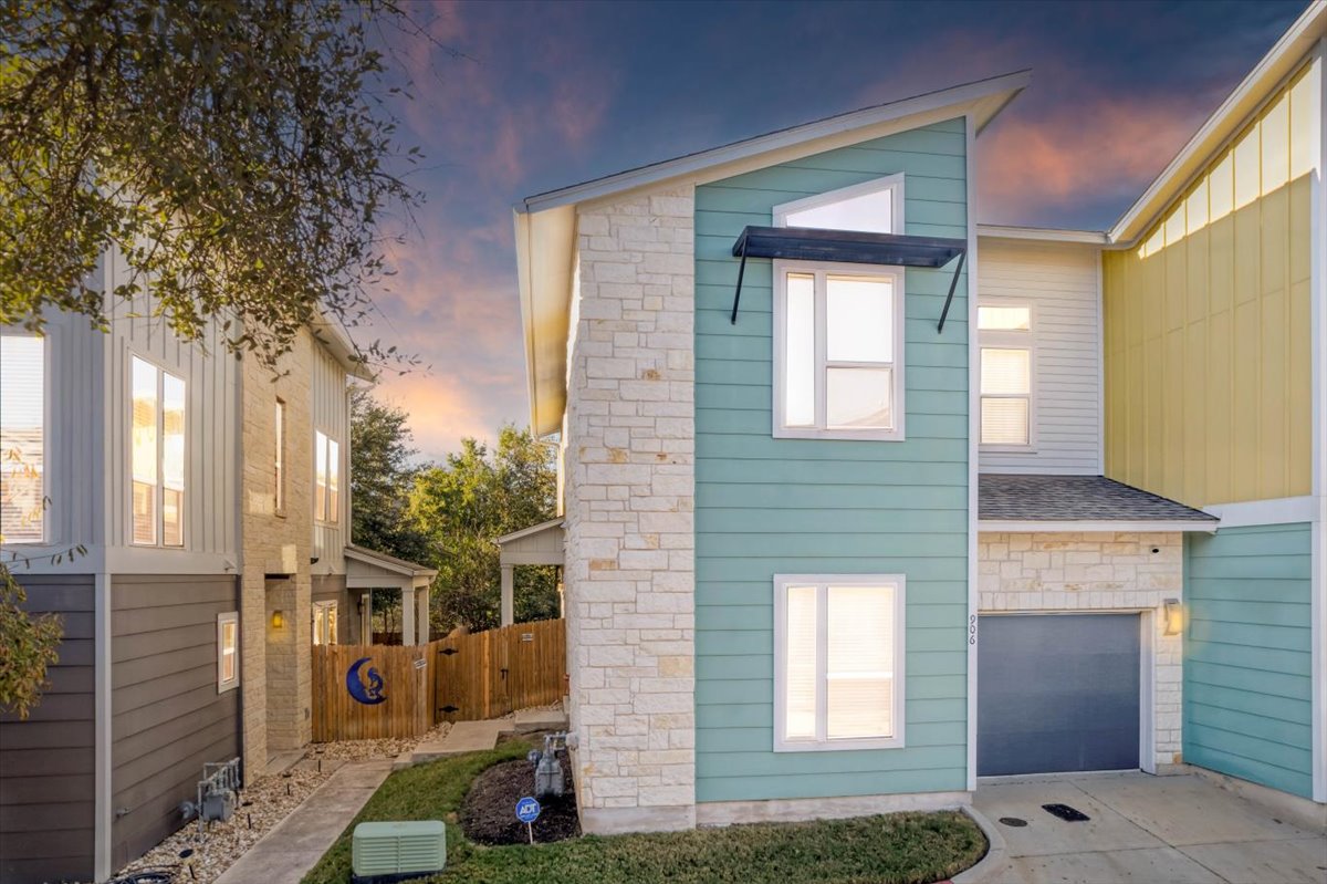 8922 Manchaca Road, Unit 906 Austin, TX 78748 - Photo 19 of 29 a front view of a house with a yard