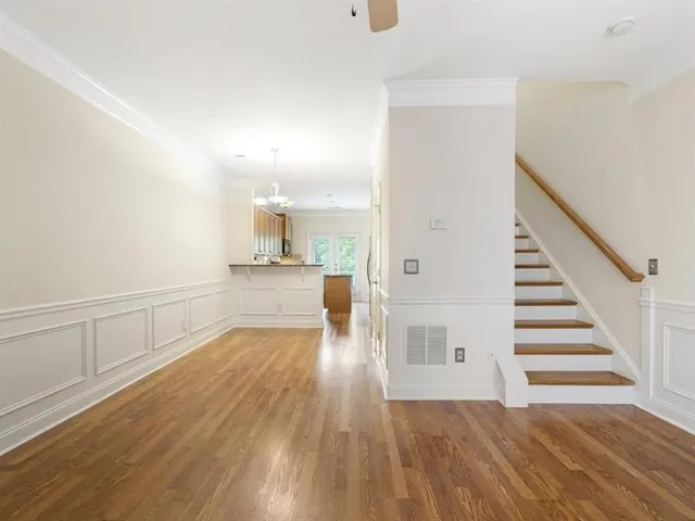 a view of a kitchen with dishwasher and a refrigerator