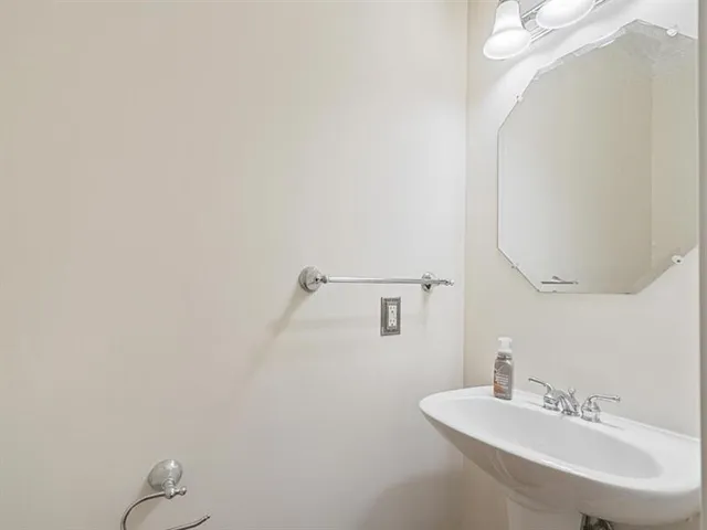 an empty room with closet and a bathroom