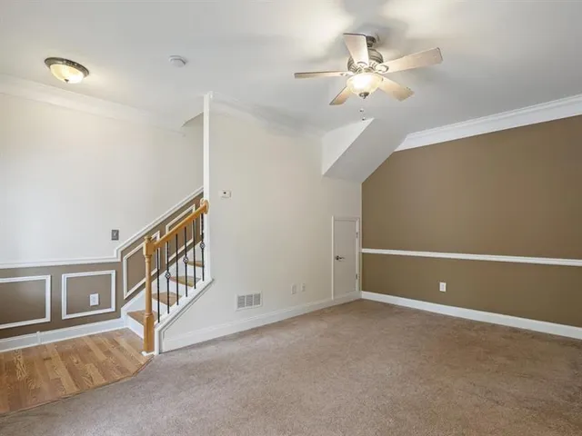 a view of an empty room with windows