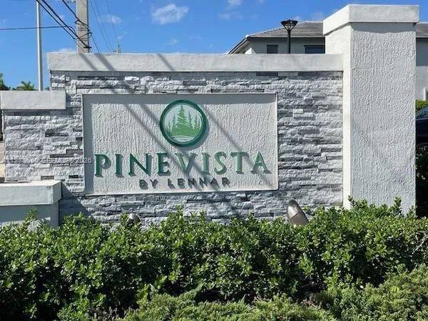 a brick building with a sign on it