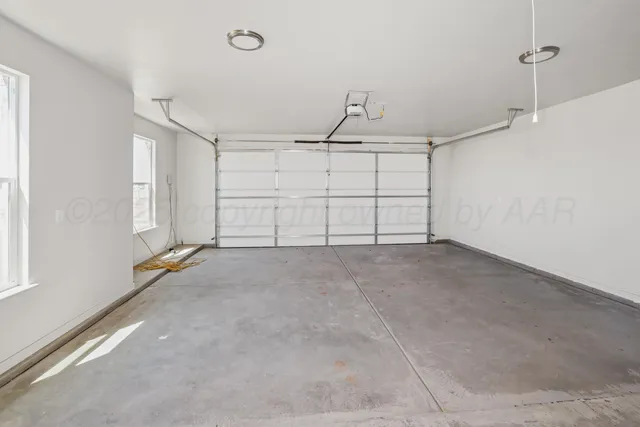 a view of house with backyard and garden