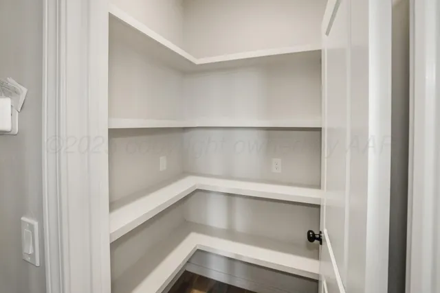 a view of an empty walk in closet