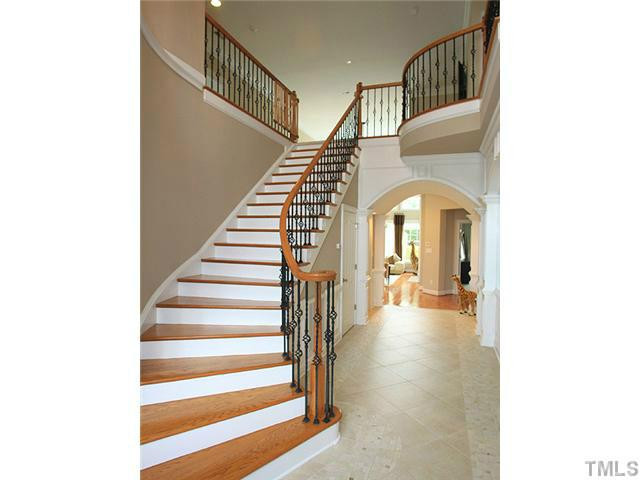 Grand foyer with tile flooring, high ceilings and gorgeous grand staircase with lovely railingwork. Access to study and main living room. Foyer