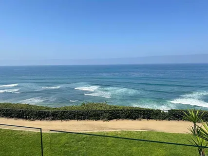 a view of an ocean from a balcony