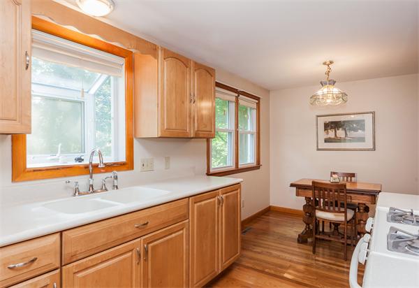 36 Blossom Road West Springfield, MA 01089 - Photo 11 of 30 a kitchen with cabinets and wooden floor
