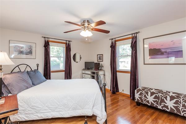 36 Blossom Road West Springfield, MA 01089 - Photo 23 of 30 a bedroom with a bed and dresser with wooden floor