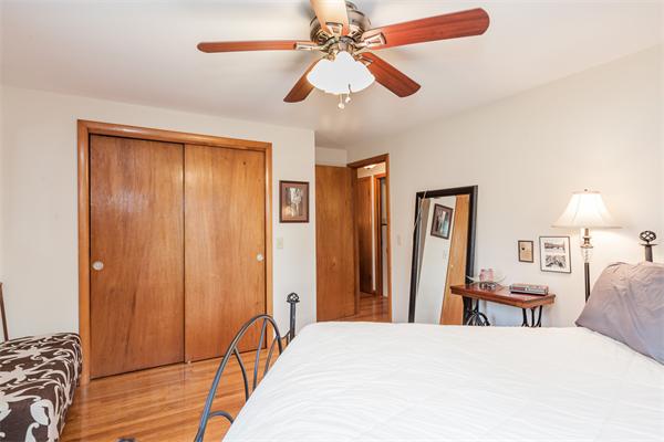 36 Blossom Road West Springfield, MA 01089 - Photo 24 of 30 a bedroom with a bed and a chandelier