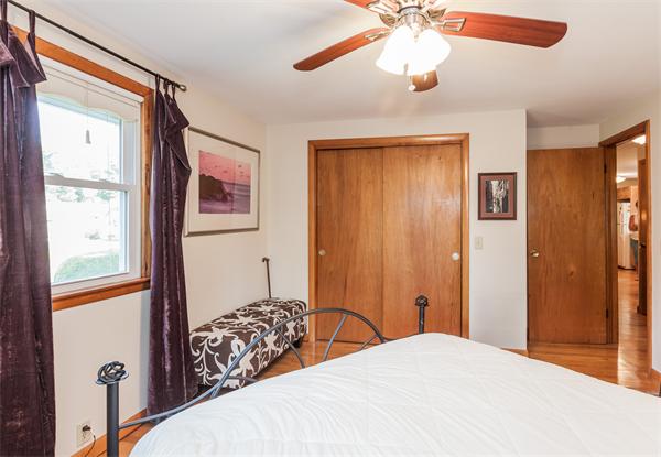 36 Blossom Road West Springfield, MA 01089 - Photo 25 of 30 a bedroom with a bed and a chandelier