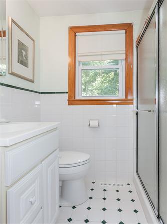 36 Blossom Road West Springfield, MA 01089 - Photo 28 of 30 a bathroom with a toilet a sink and a window