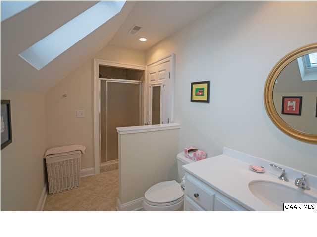 1876 Westview Road Charlottesville, VA 22903 - Photo 24 of 31 a bathroom with a sink toilet and a mirror