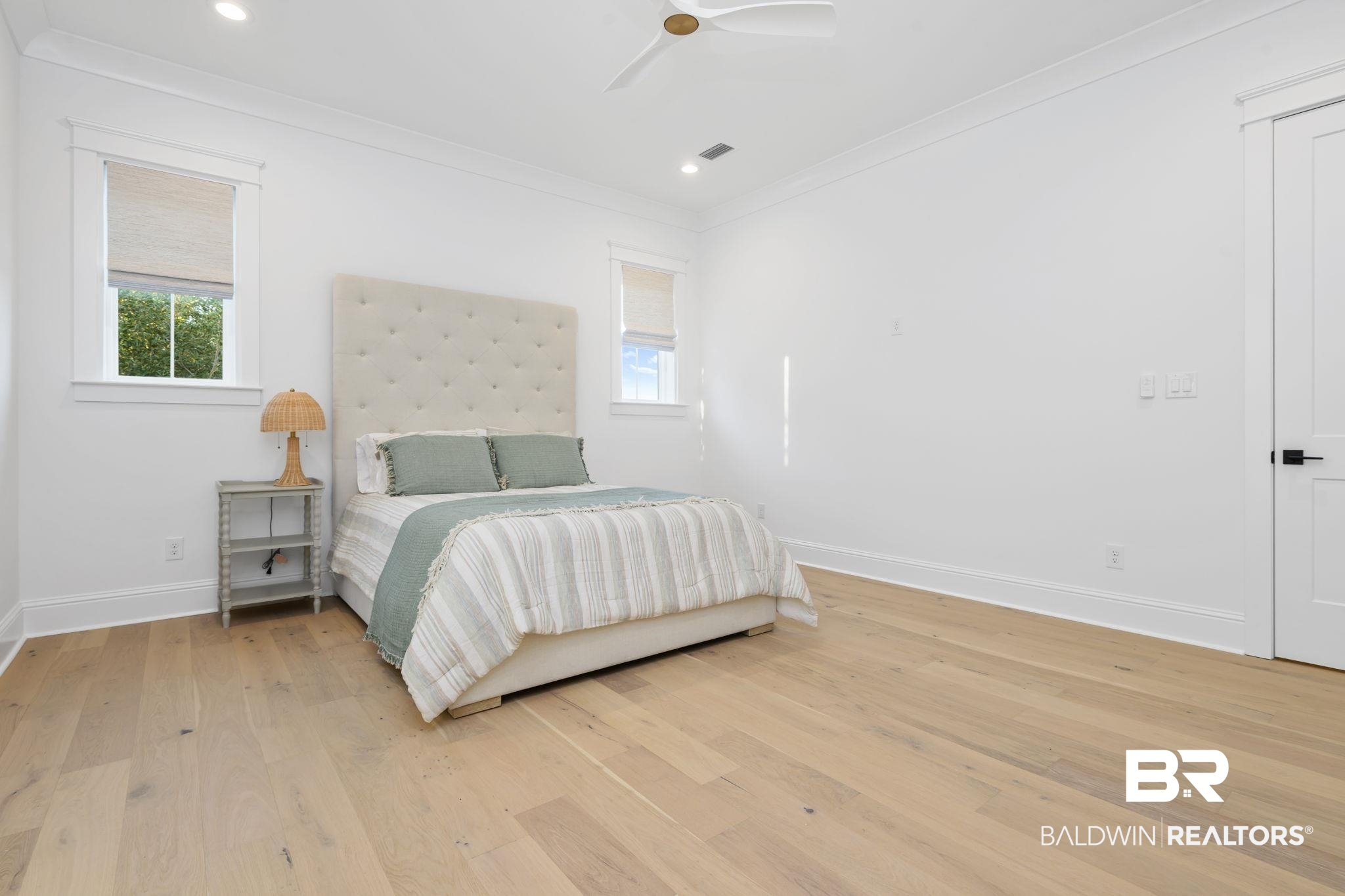 30313 River Road Orange Beach, AL 36561 - Photo 33 of 50 Bedroom with multiple windows, light wood-style floors, ceiling fan, crown molding, and recessed lighting