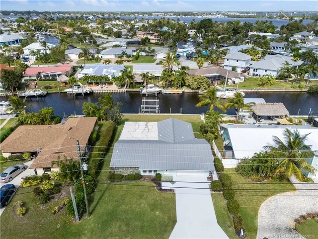 an aerial view of a house with outdoor space