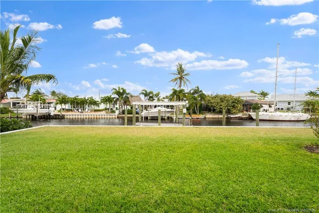 a swimming pool view with a lake view