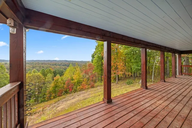 a view of a room with wooden floor and outdoor space