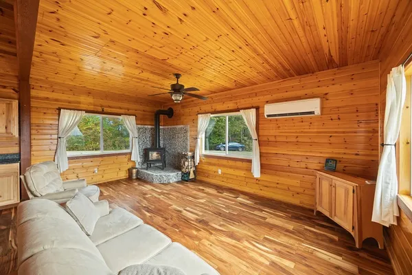 a bedroom with furniture and large windows