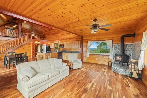 a balcony with furniture and a fireplace