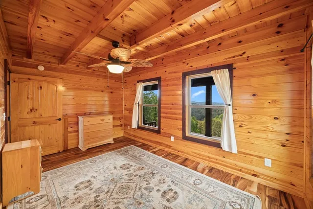 a view of a room with a wooden floor
