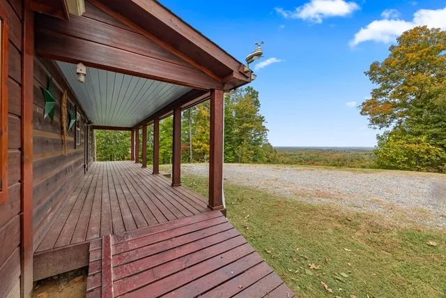 a view of a patio with wooden floor