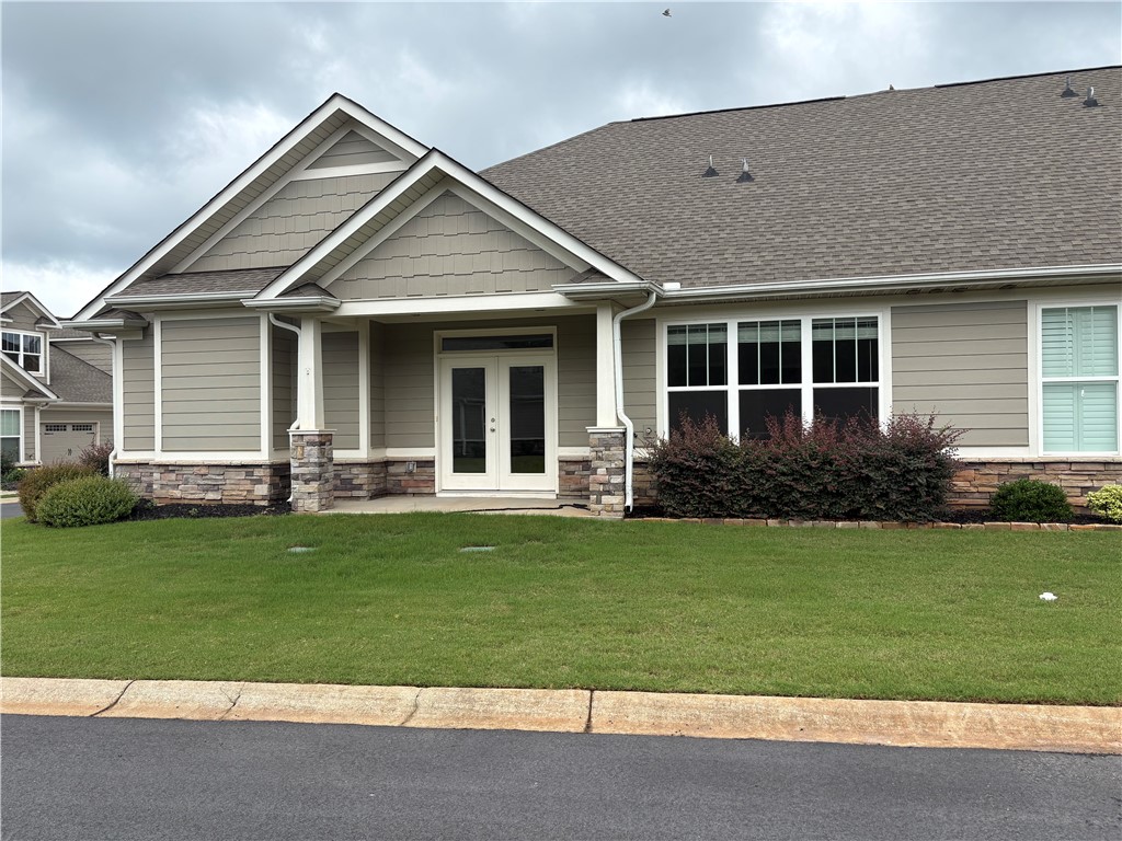 240 Meridian Way Seneca, SC 29672 - Photo 2 of 19 A well-maintained lawn welcomes you to this inviting home featuring a blend of stone and siding.
