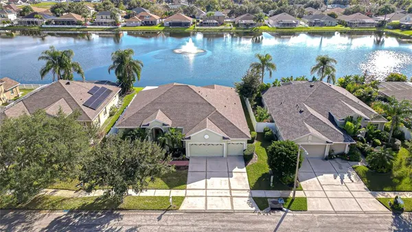 a aerial view of a house with garden space and lake view