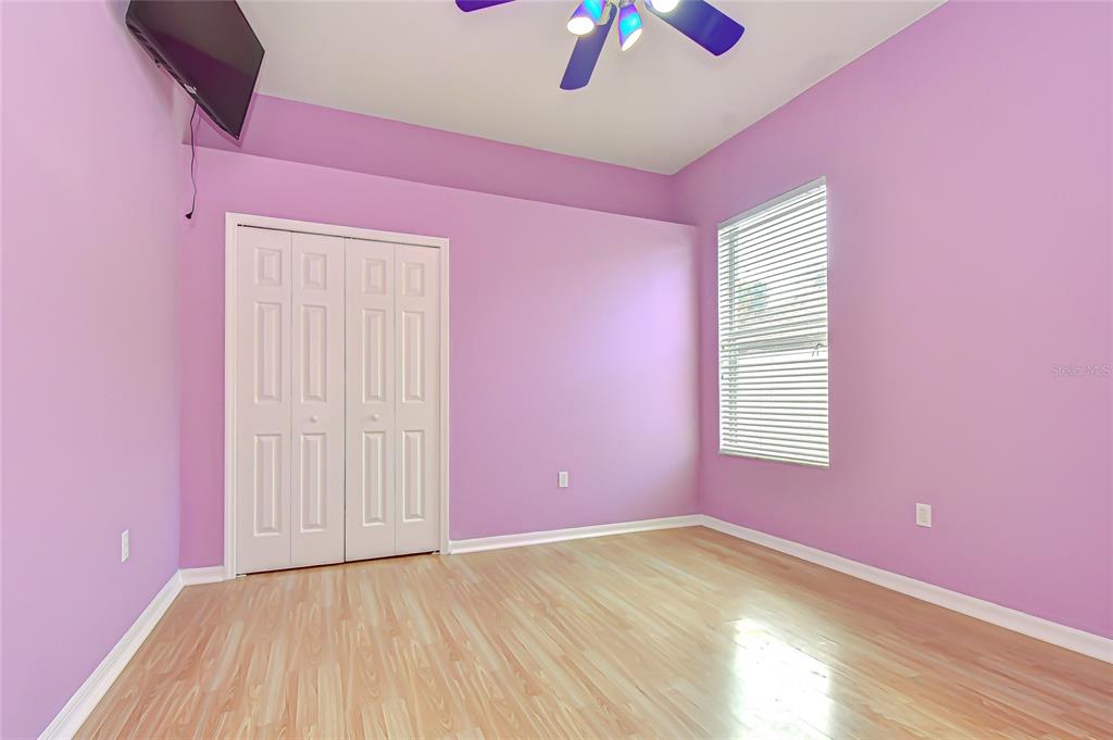 22704 Cliffside Way Land O' Lakes, FL 34639 - Photo 19 of 33 wooden floor and windows in a room