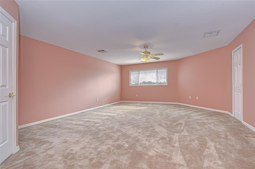 22704 Cliffside Way Land O' Lakes, FL 34639 - Photo 22 of 33 an empty room with a empty space and window