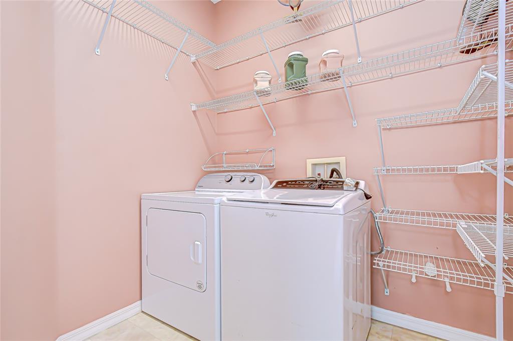 22704 Cliffside Way Land O' Lakes, FL 34639 - Photo 24 of 33 a utility room with dryer and washer