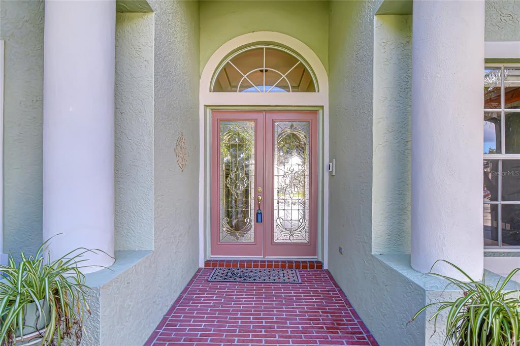 22704 Cliffside Way Land O' Lakes, FL 34639 - Photo 6 of 33 a view of front door with wooden floor