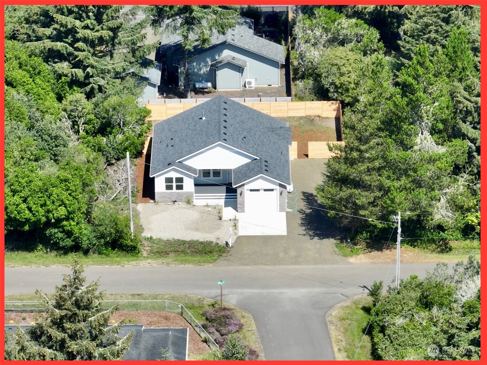 154 Seagate Street Southwest Ocean Shores, WA 98569 - Photo 11 of 36 a front view of a house with a yard and tree