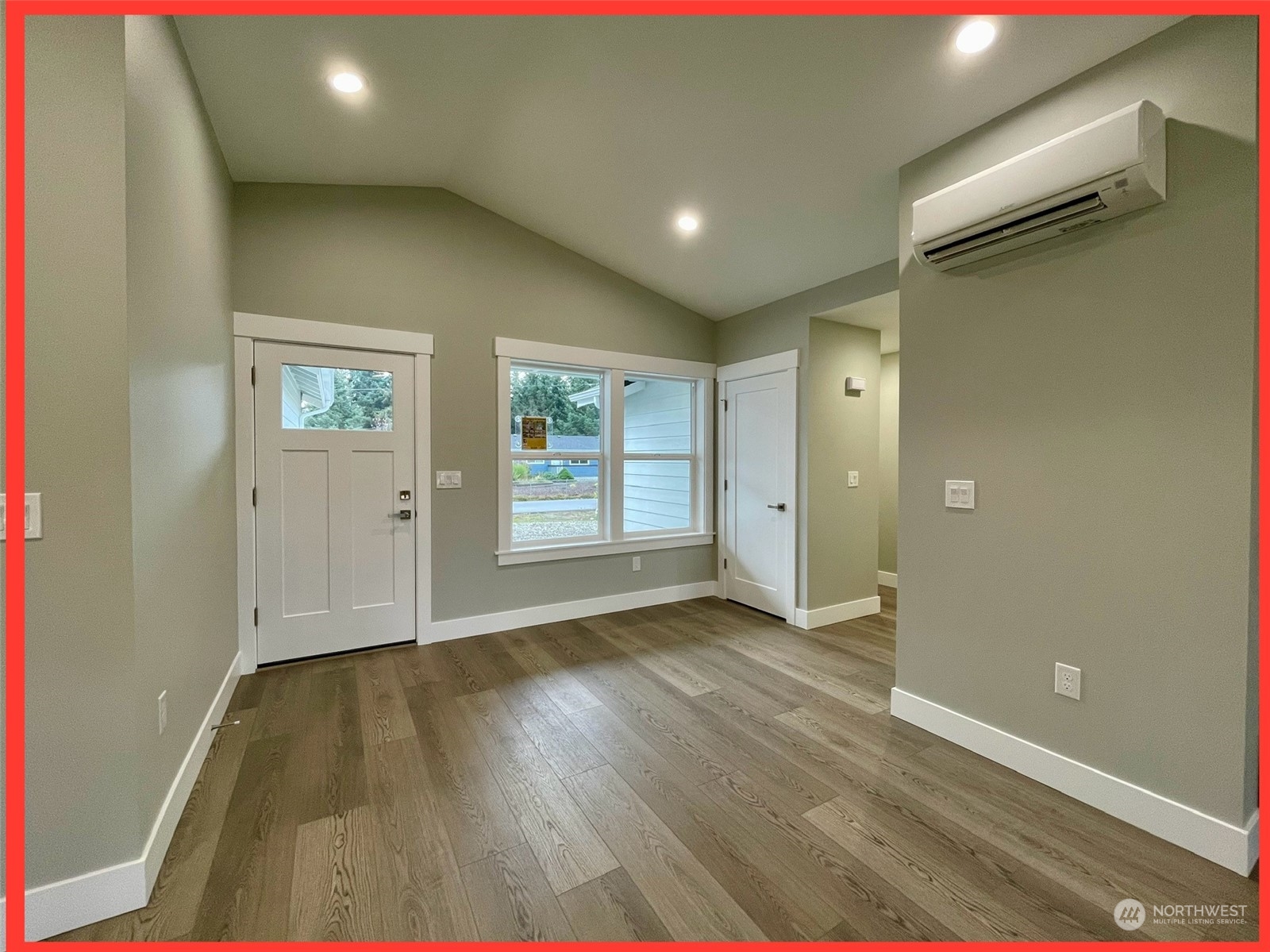 154 Seagate Street Southwest Ocean Shores, WA 98569 - Photo 13 of 36 wooden floor in an empty room with a window