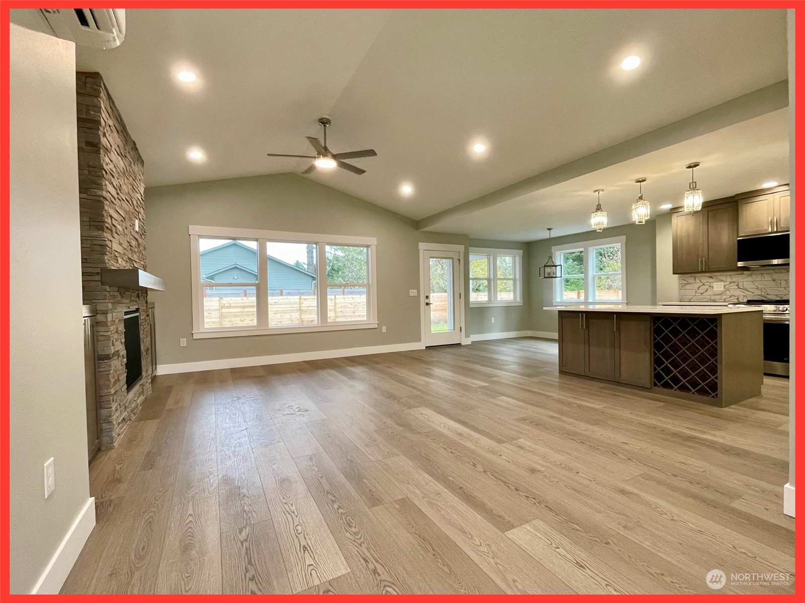154 Seagate Street Southwest Ocean Shores, WA 98569 - Photo 14 of 36 an empty room with wooden floor and windows