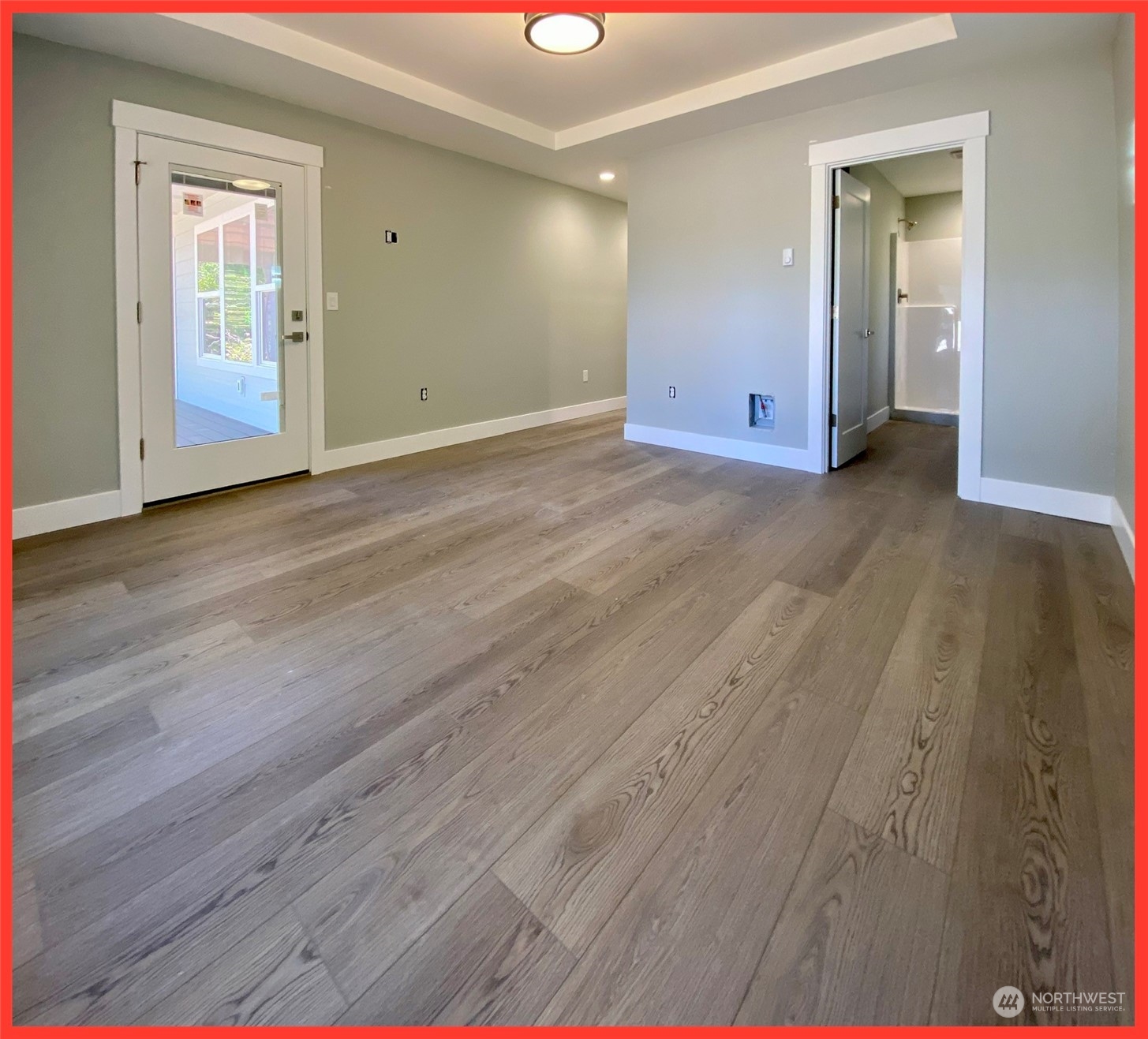 154 Seagate Street Southwest Ocean Shores, WA 98569 - Photo 25 of 36 a view of an empty room with wooden floor