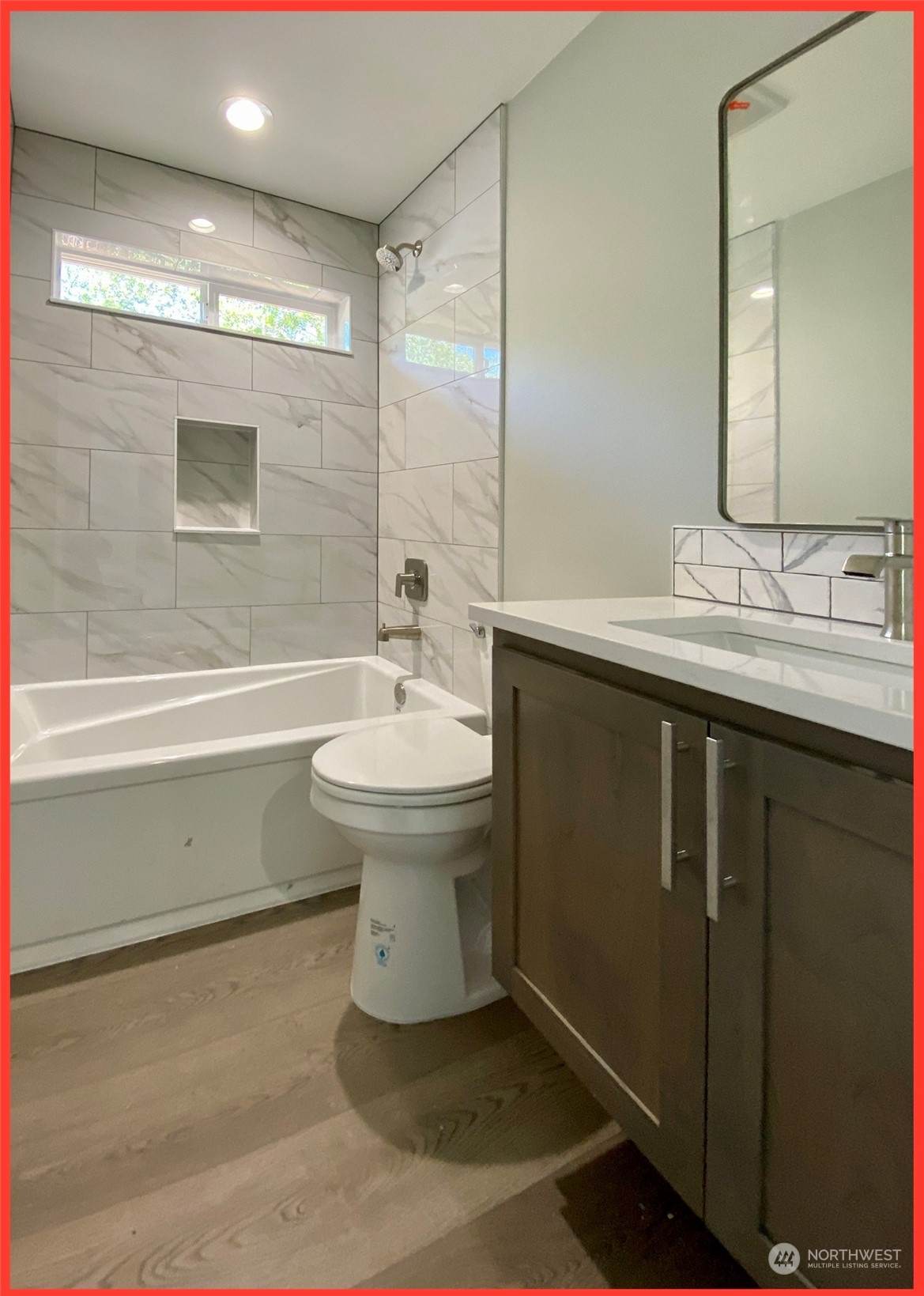 154 Seagate Street Southwest Ocean Shores, WA 98569 - Photo 34 of 36 a bathroom with a sink toilet and a mirror