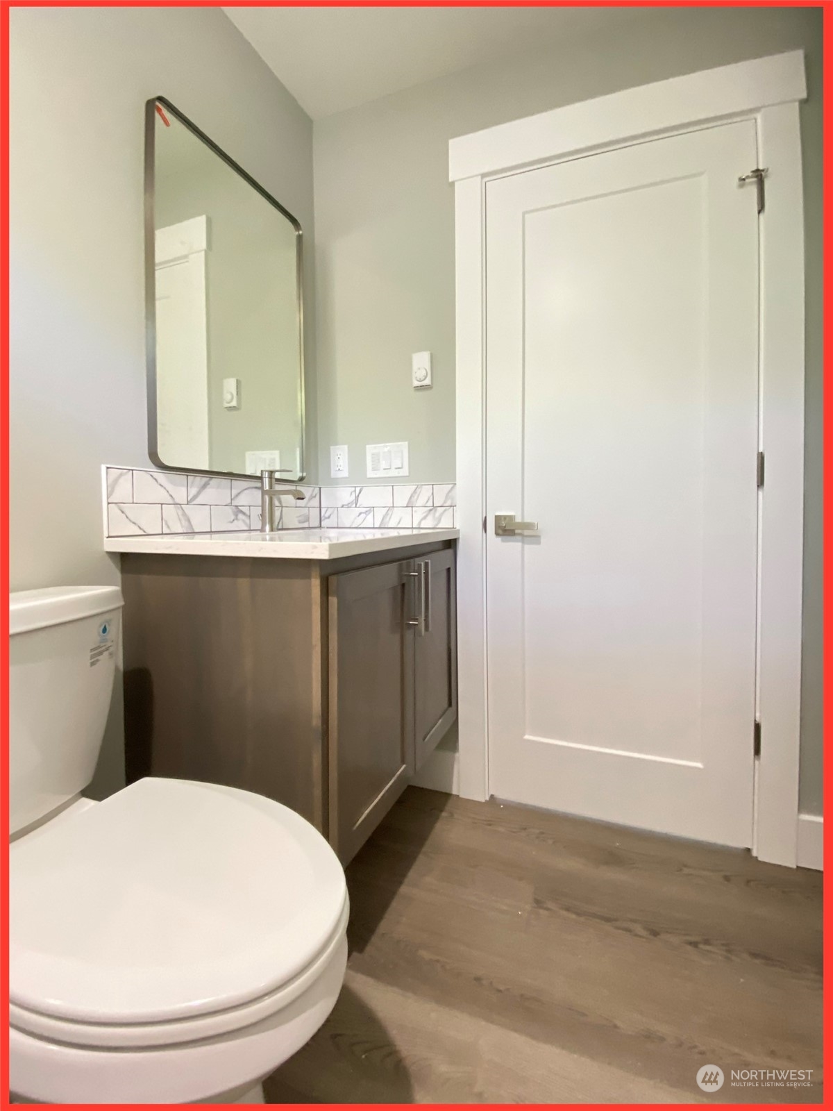 154 Seagate Street Southwest Ocean Shores, WA 98569 - Photo 35 of 36 a bathroom with a sink and a mirror