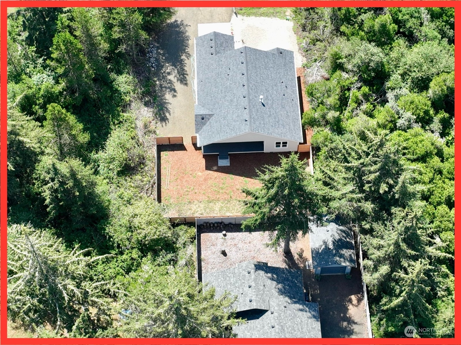 154 Seagate Street Southwest Ocean Shores, WA 98569 - Photo 9 of 36 an aerial view of a house with a yard
