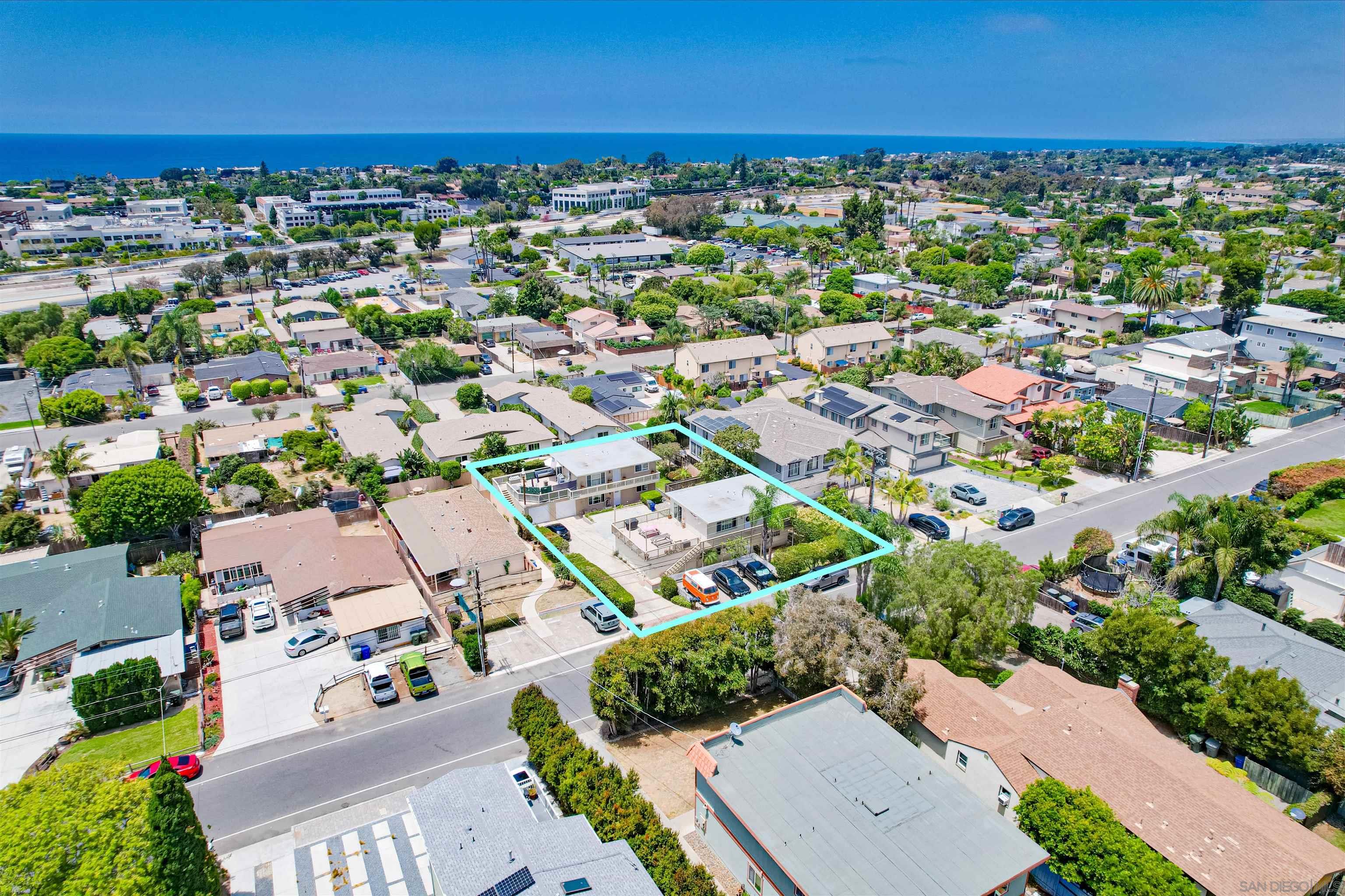 1076 Gardena Road Encinitas, CA 92024 - Photo 8 of 9 an aerial view of a city with lots of residential buildings ocean and mountain view in back